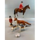 Beswick huntsman on horse with black cap and red jacket, together with two Beswick hunting hounds, a