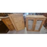 Two similar pine farmhouse Victorian single door blind panelled hanging corner cupboards together