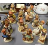 Tray of Goebel Hummel West German figurines of little girls in various poses, some with animals. (