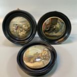 Three Prattware pottery pot lids in ebonised frames, to include: The Enthusiast, Peace and another