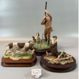 Three Border Fine Arts sculptures to include: Retriever dog, otter and huntsman with rifle and dogs.