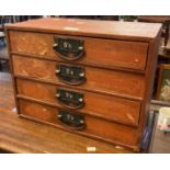 Vintage leather finish table top four drawer filing cabinet. (B.P. 21% + VAT)