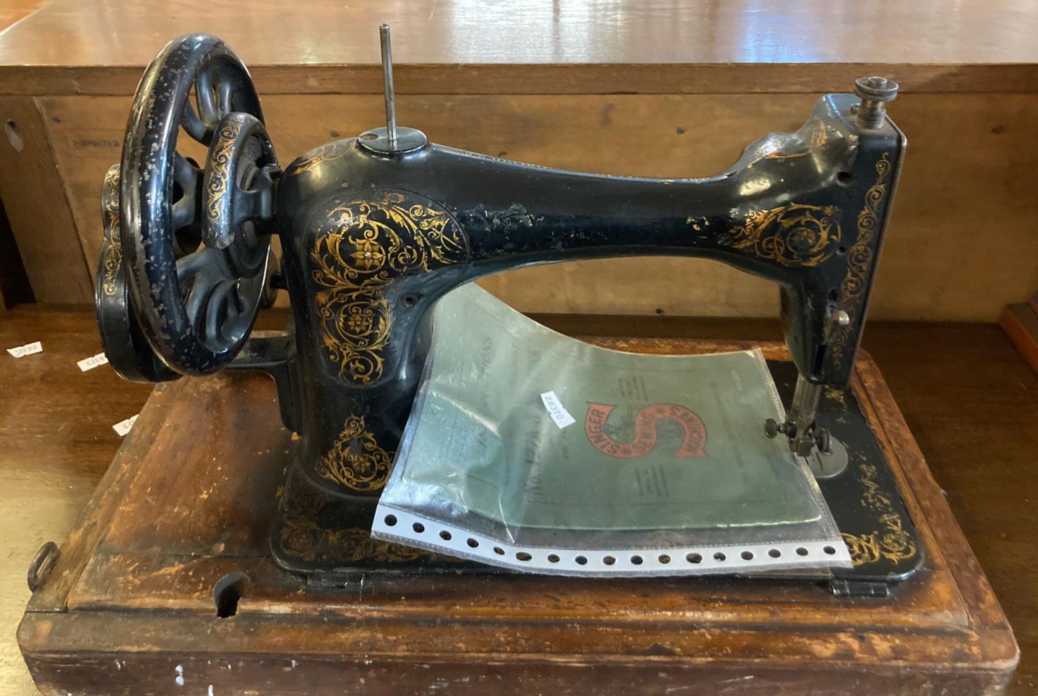 Singer hand sewing machine with bentwood case and instruction leaflet for Nos 127K and 128K. (B.P.