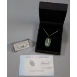 9K jade and gold pendant with 9ct gold chain, with COA. (B.P. 21% + VAT)