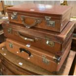 Two vintage leather suitcases and another vintage suitcase. (3) (B.P. 21% + VAT)