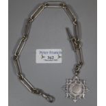 Silver bar link gentleman's watch chain with circular pierced silver fob and T bar. 1.7 troy ozs