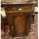 Small 19th century mahogany single door blind panelled hanging corner cupboard. (B.P. 21% + VAT)