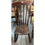 Late Victorian elm and stained slatback rocking chair. (B.P. 21% + VAT)