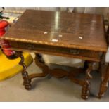 Early 20th century oak single drawer side table standing on barley twist legs and shaped central