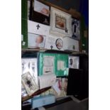 Two boxes containing mostly christening sets and other celebratory items including: picture