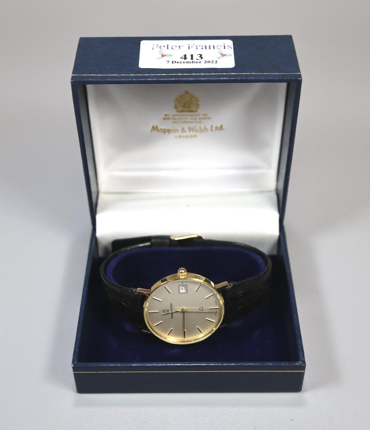 Yellow metal Mappin & Webb presentation gent's wristwatch dated 1985 with black leather strap, in