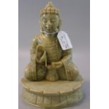 A heavy green soapstone carved seated buddha on a lotus base. (B.P. 21% + VAT)