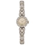UNIVERSAL Damenarmbanduhr Edle Uhr in Weissgold 18K Lünette sowie Uhrband verziert mit Diamanten.