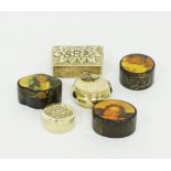 A collection of three brass and three papier mache pill boxes.