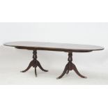 A Cypriot Savvides Regency-style extendable pillar dining table