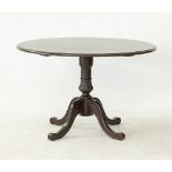 A Cypriot round stained beech center table