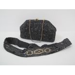 A vintage evening black beaded clutch bag