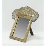 A table mirror in a metal frame