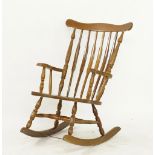 A beech wood rocking armchair