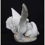 A Lladro porcelain figurine of two white doves
