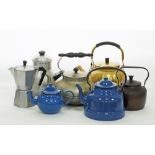 A collection of vintage metal kettles