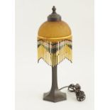 Art Deco bronze table lamp with a glass shade