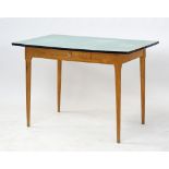 A beechwood and Formica rectangular table.