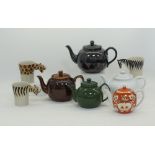 A collection of ceramic tea pots