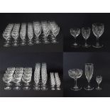 A collection of vintage engraved footed glasses
