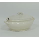 An oval porcelain soup tureen