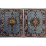 A pair of Persian / Syrian carpets hand woven in turquoise ground