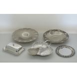 A collection of silver plated and white metal serving dishes
