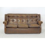 A three seater sofa, in brown Pegasus leather by Art Forma Upholstery Ltd