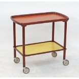 A stained beechwood serving trolley with Formica laminate tops