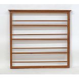 A Cypriot pine wood shelf unit for displaying plates