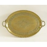 An oval brass tray with two handles