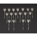 A Cypriot set of seventeen silver sweetmeat forks by G. Stephanides