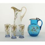 Two Bohemian enameled pitchers with three glasses