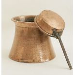 A vintage copper vessel of a waisted shape