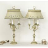 A pair of metal table lamps with three arms