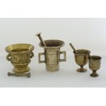 A collection of four brass mortars and pestles