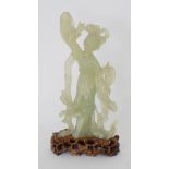 A Chinese carved celadon jade figure