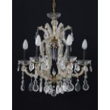 A seven light - six arm crystal chandelier