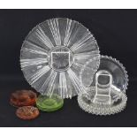 A clear pressed glass cake platter