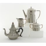 A modern stainless steel tea set