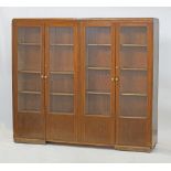 A stained beech veneered plywood bookshelf unit