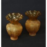 A pair of amber frosted glass lamp shades