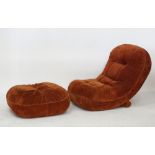 A tan suede leather reclining lounge chair with associated ottoman