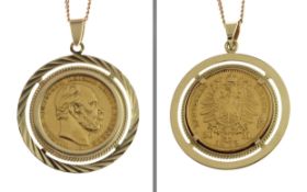 Kette mit Muenzanhaenger 16.84g 585/- und 900/- Gold. Laenge ca. 66.50 cm