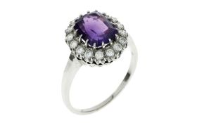 Ring 7.16g 585/- Weissgold mit 16 Diamanten zus. ca. 0.64 ct. und Amethyst. Ringgroesse ca. 66